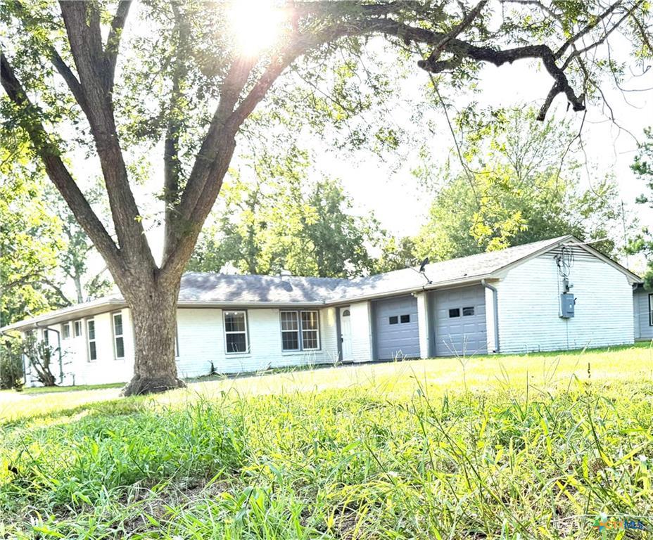 A classic ranch home nestled among mature trees o