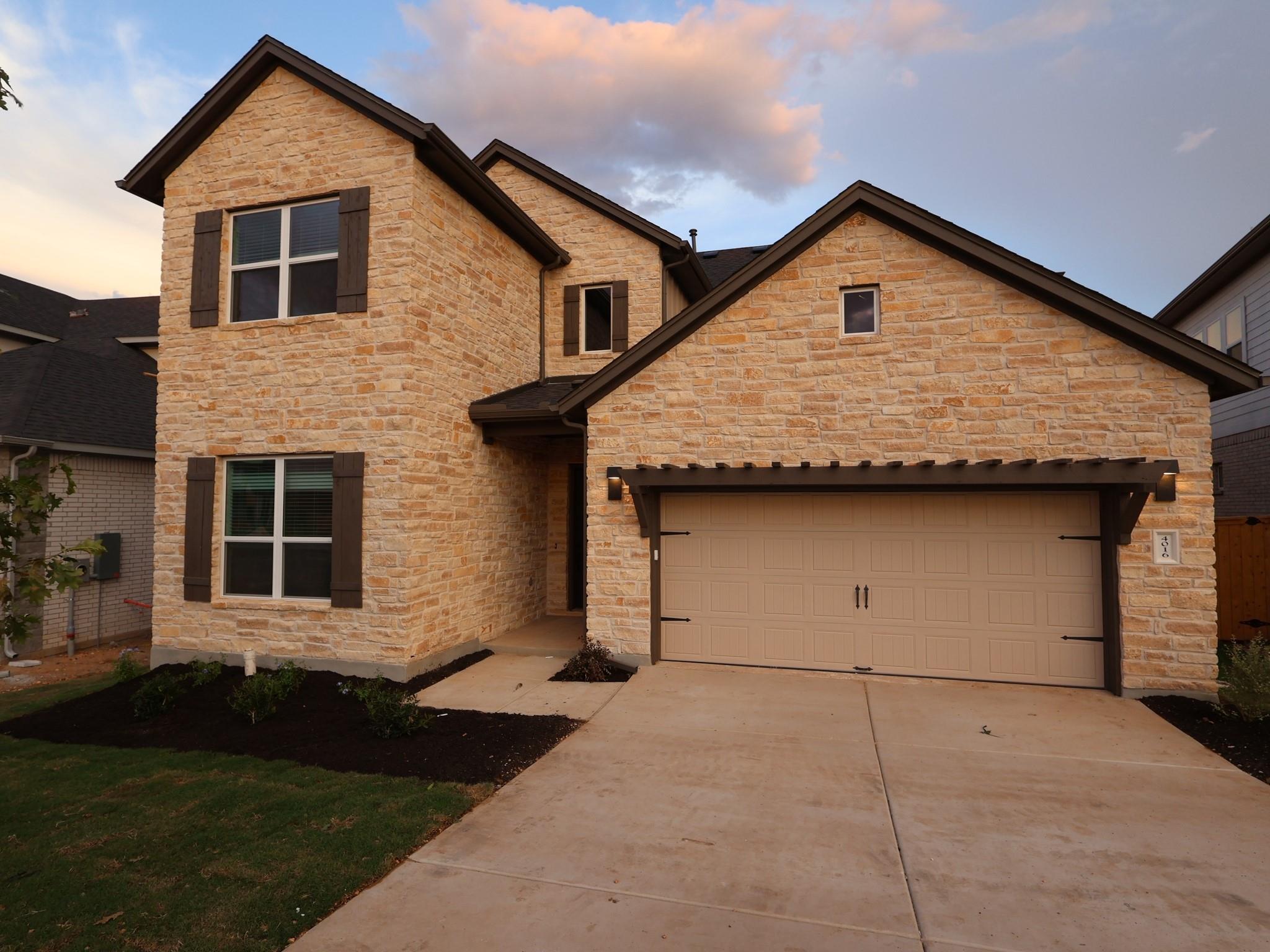 Textured stone veneer creates a timeless exterior