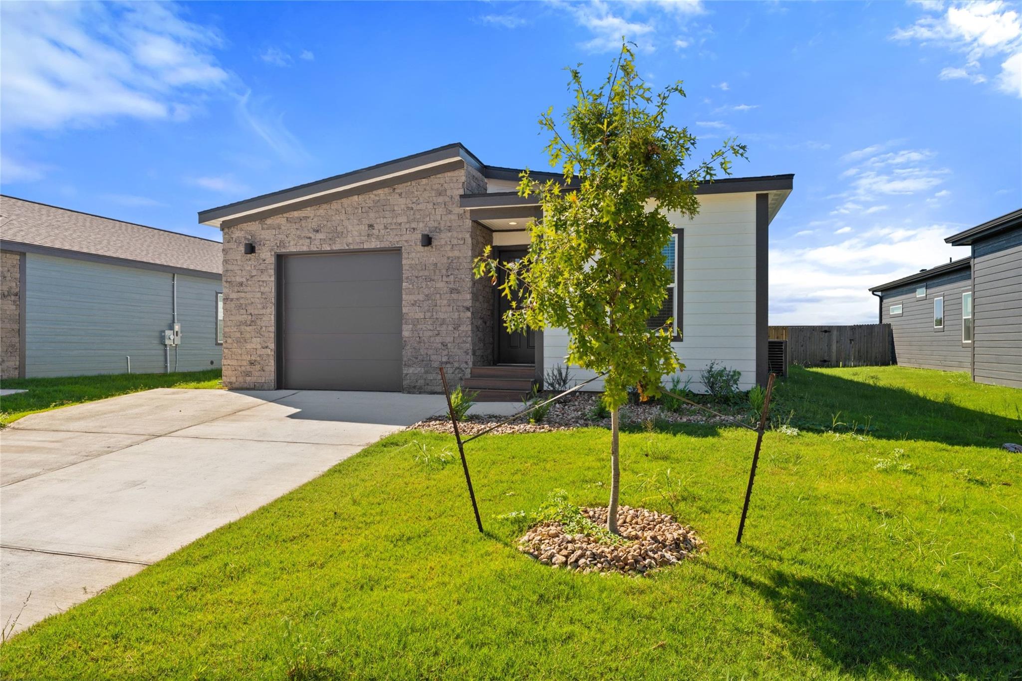 Clean lines and stone accents define this modern 