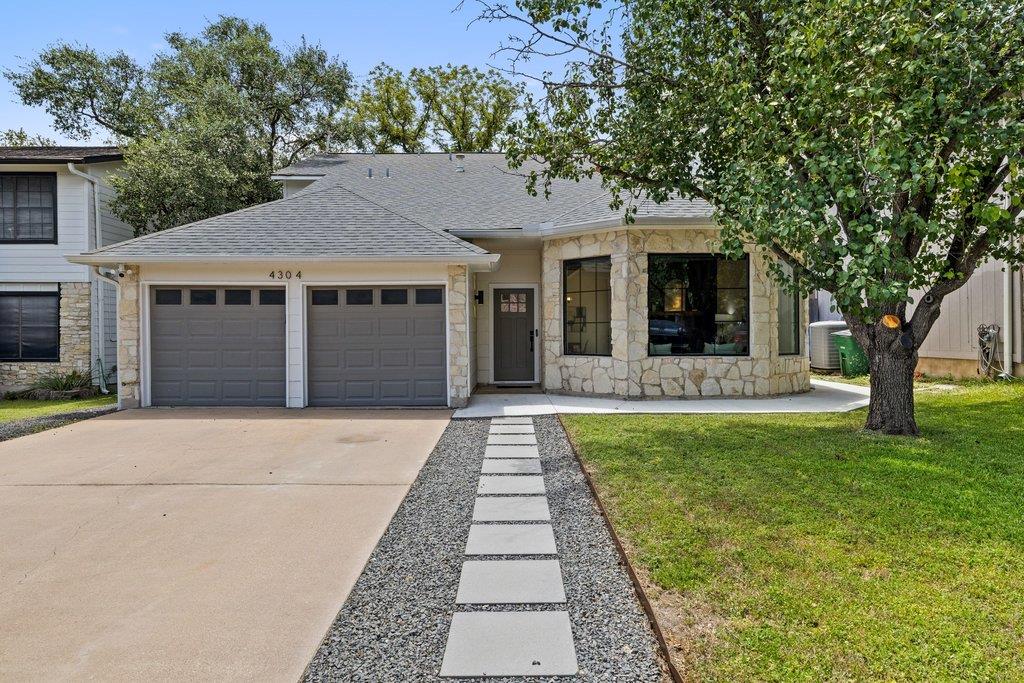 A meticulously maintained residence with a two-ca