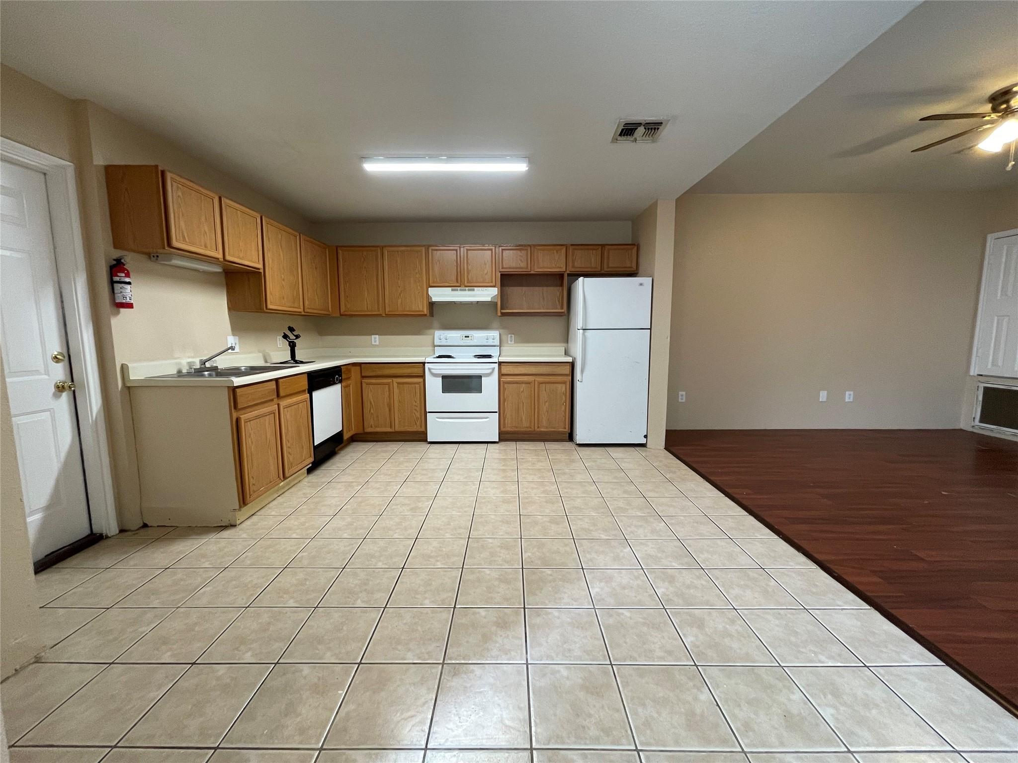 Functional kitchen with ample cabinetry and essen