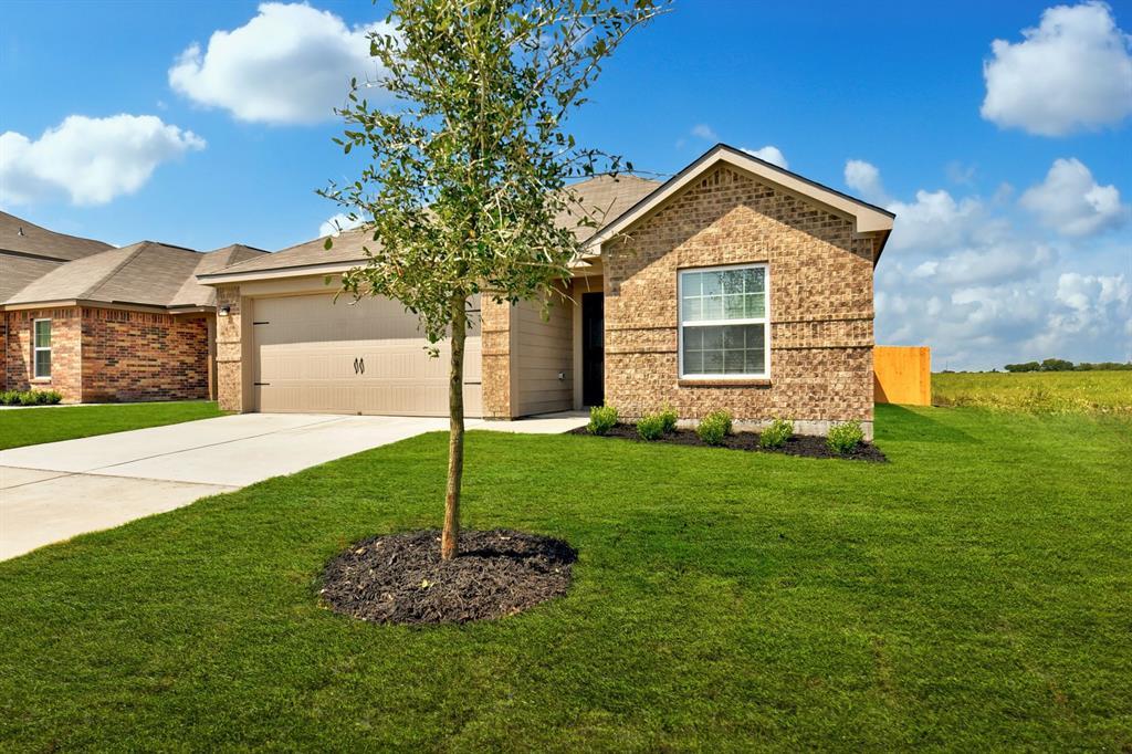 A well-maintained lawn and sturdy brick facade de