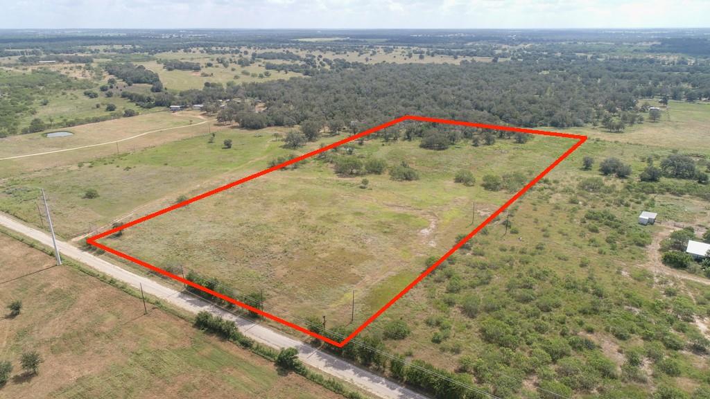 A sprawling rural lot outlined in red offers ampl
