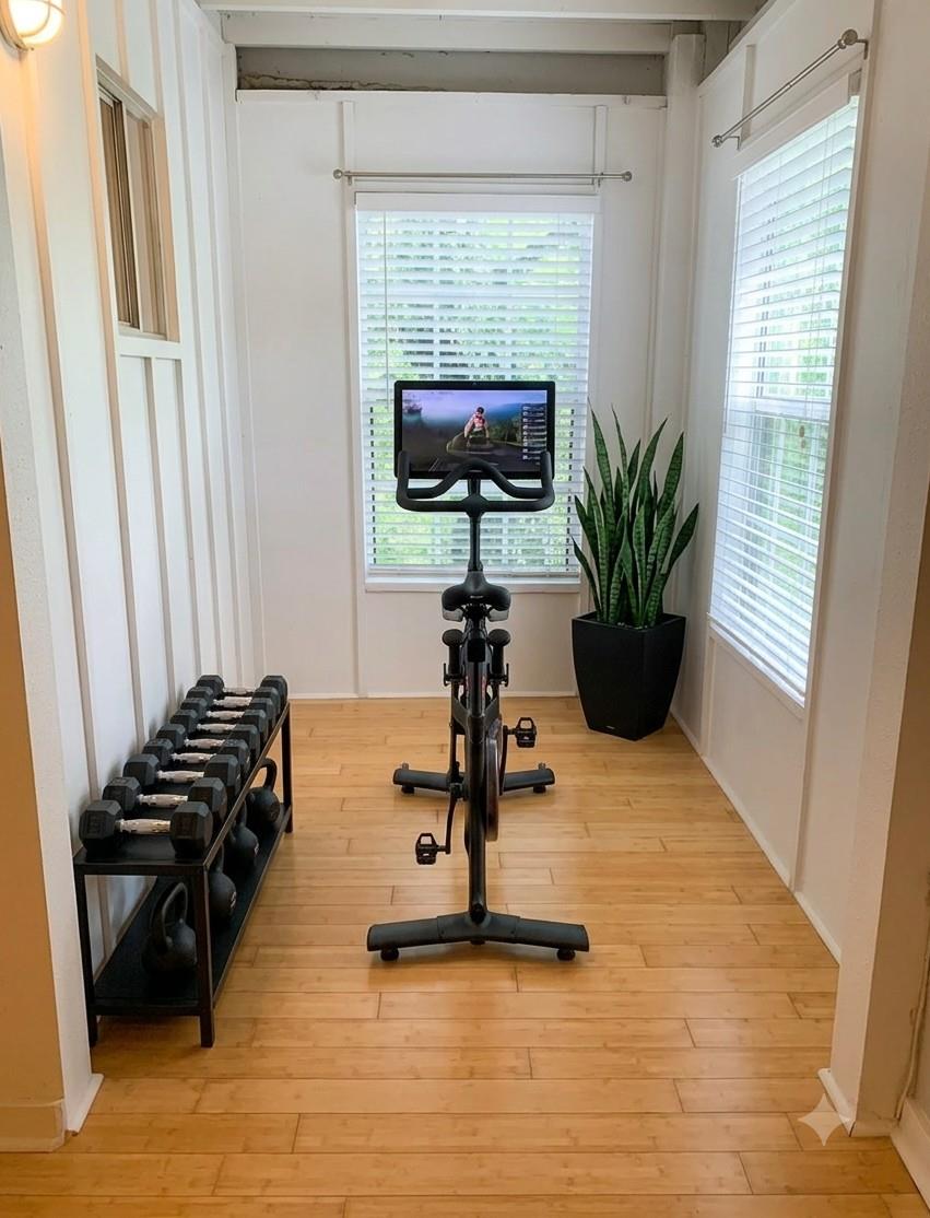 A dedicated fitness area with natural light and r