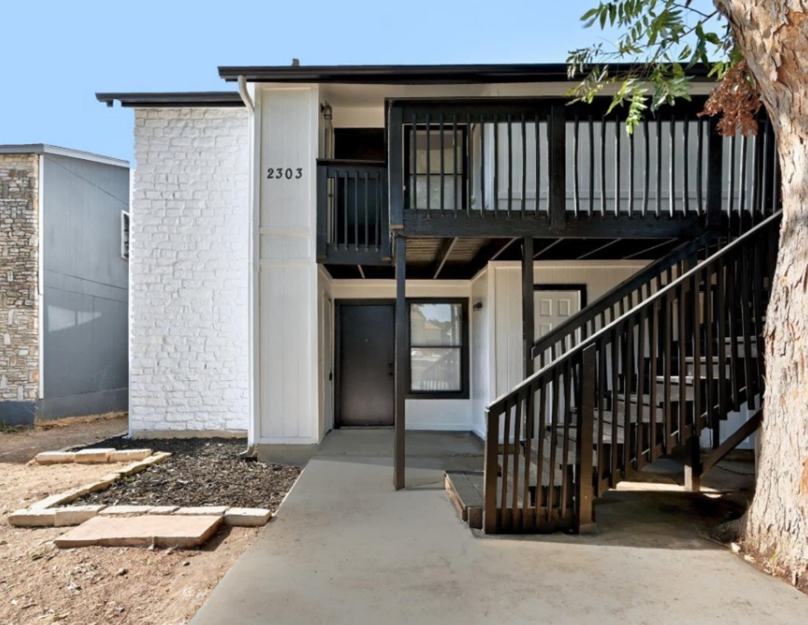 An inviting exterior with a contrasting black and