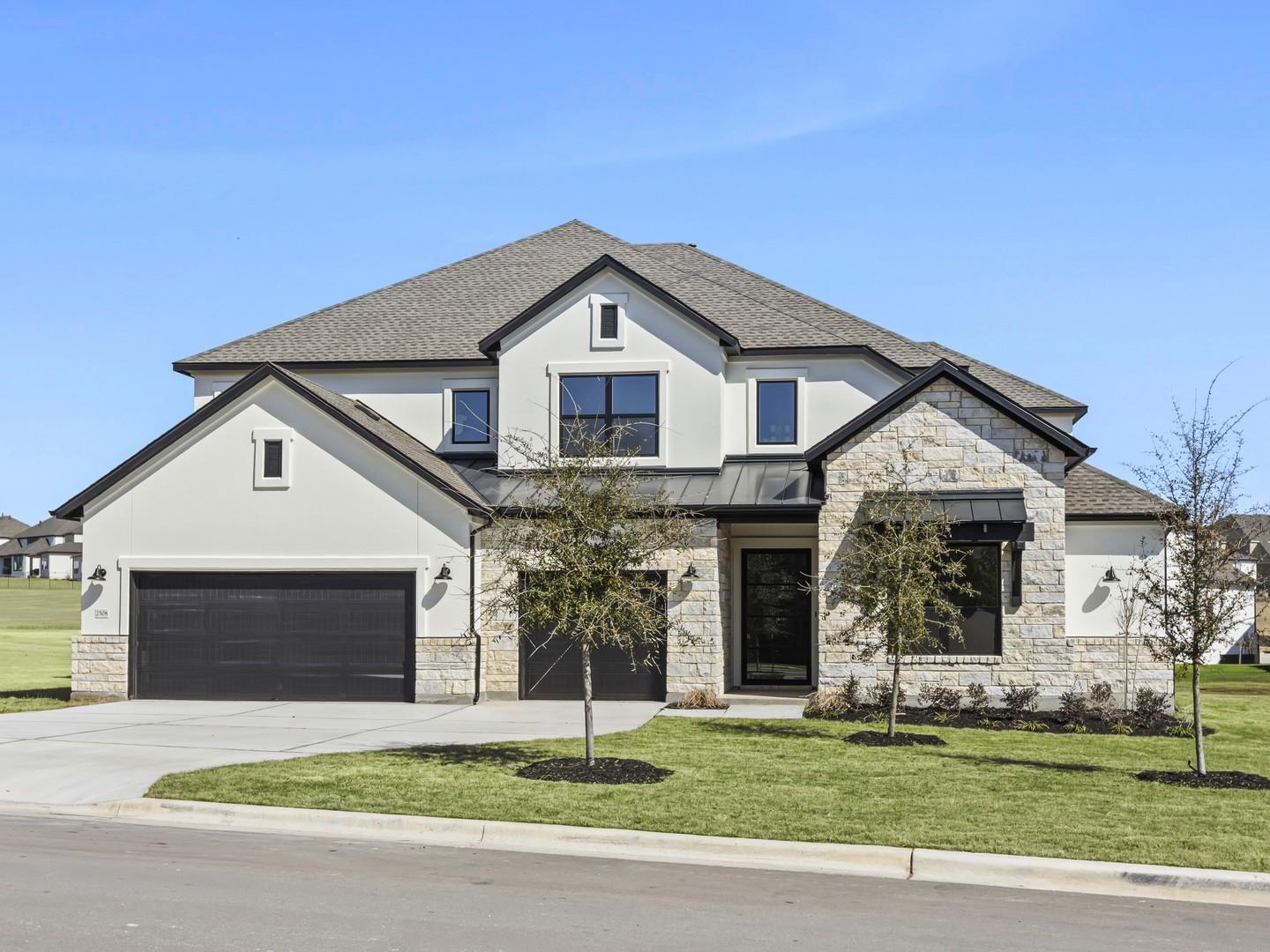 Modern stone and stucco facade creates a commandi