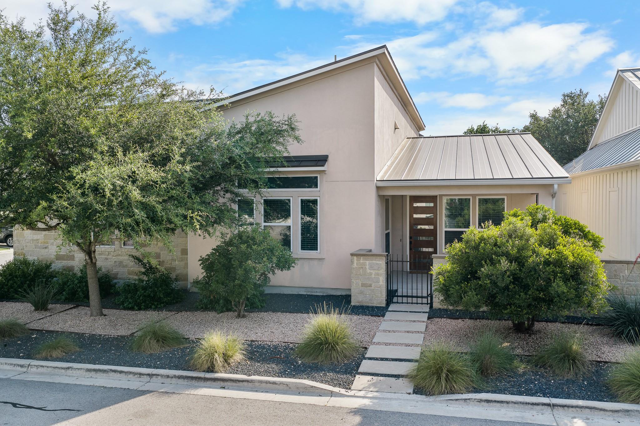 A modern exterior facade with a sleek metal roof 