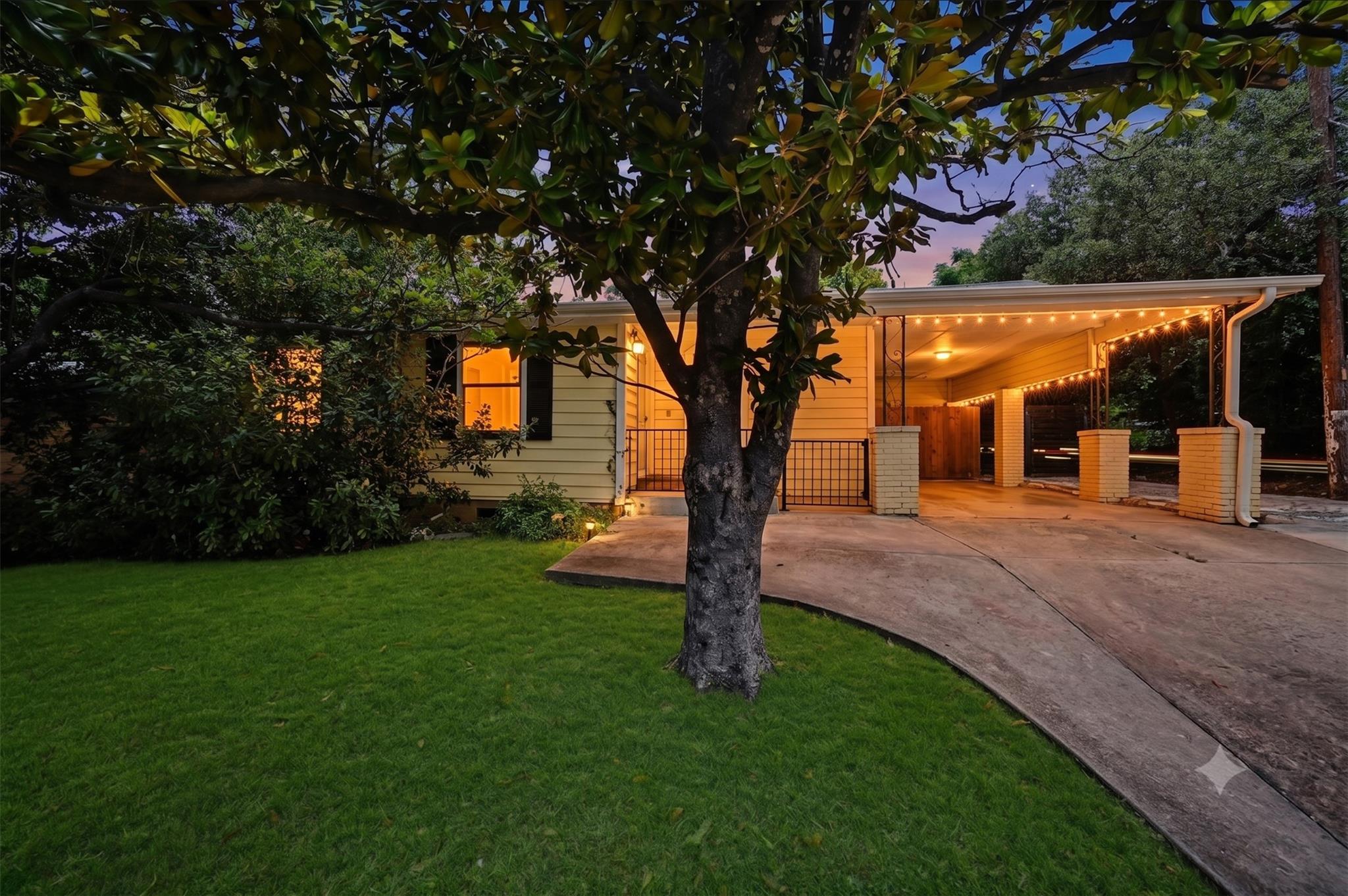 A welcoming front exterior at twilight, featuring