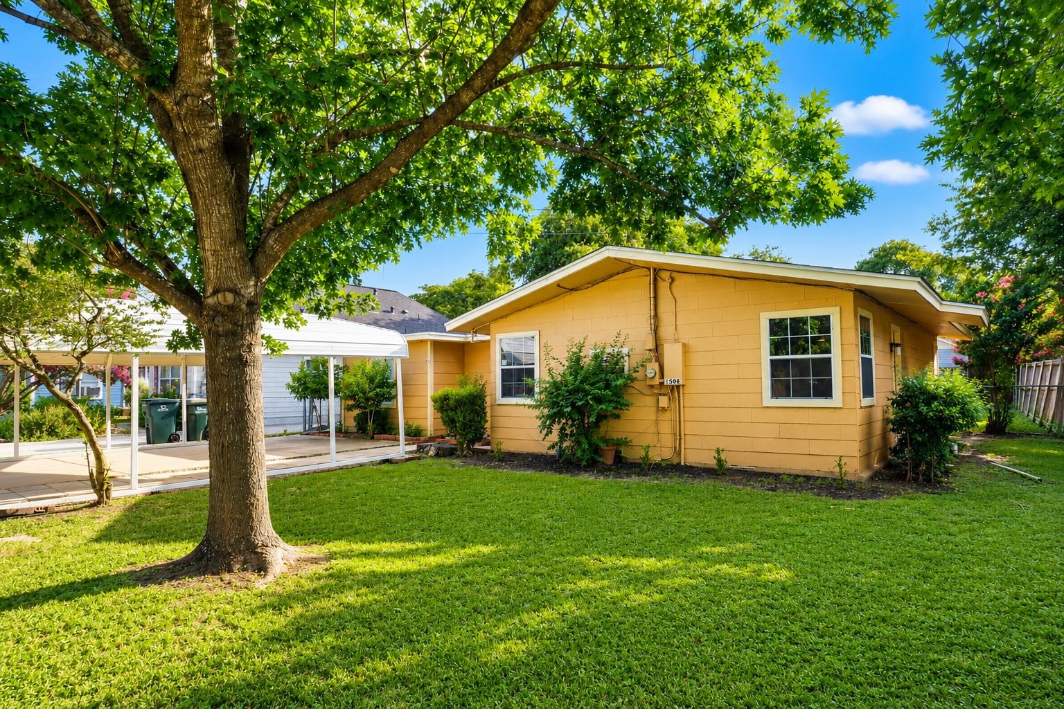 A well-maintained lawn embraces a welcoming resid