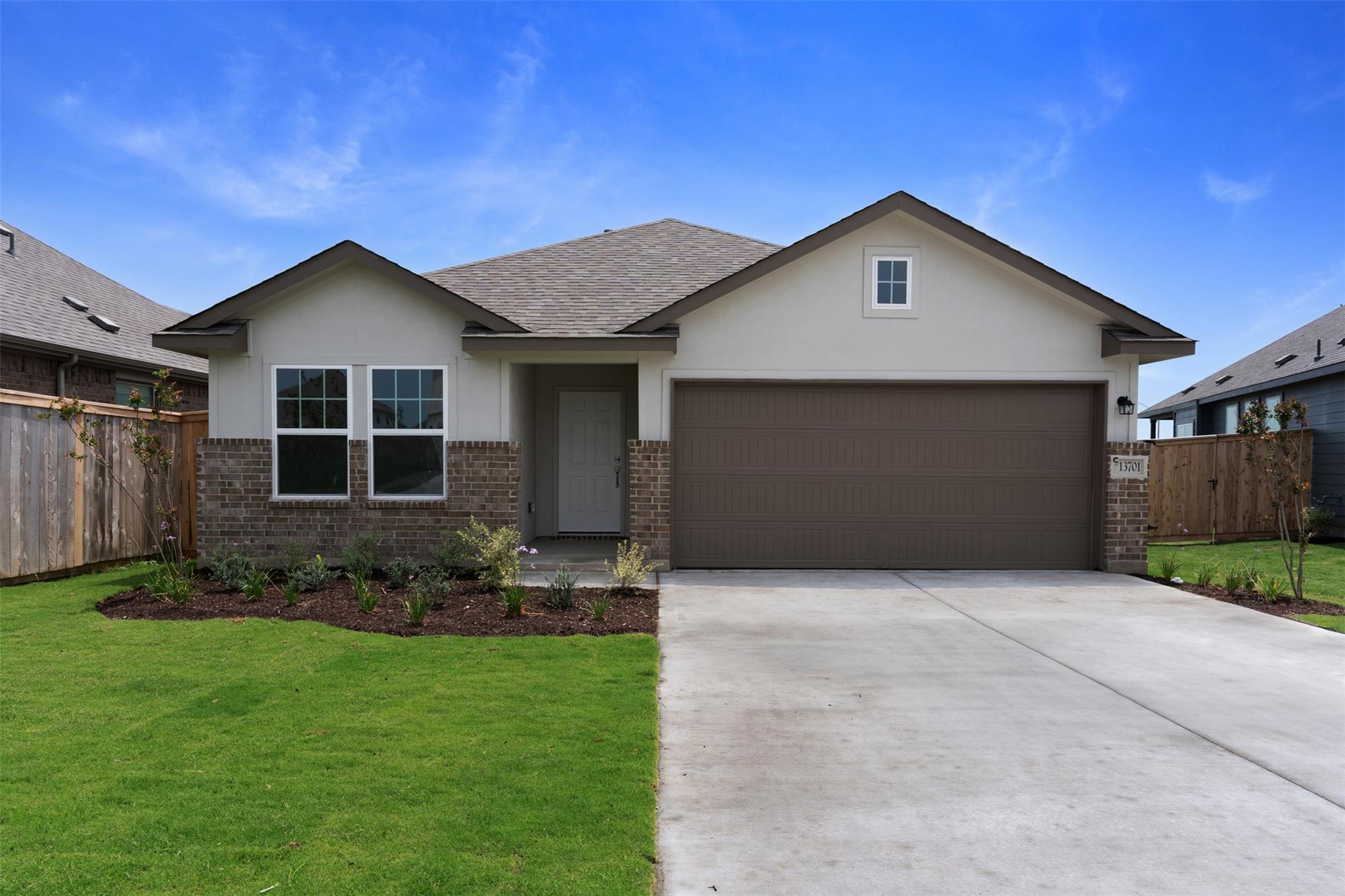 A well-maintained lawn and neat landscaping enhan