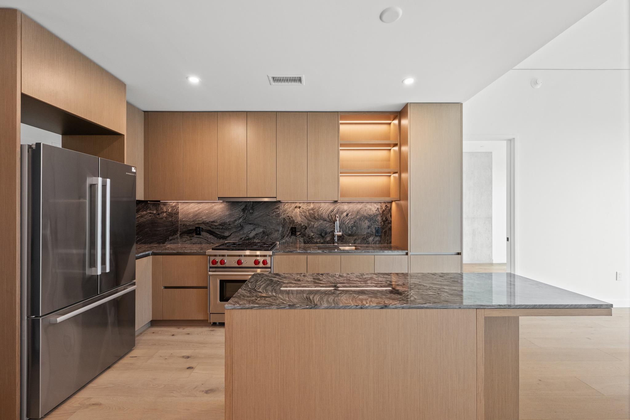 Dramatic dark stone countertops pair beautifully 