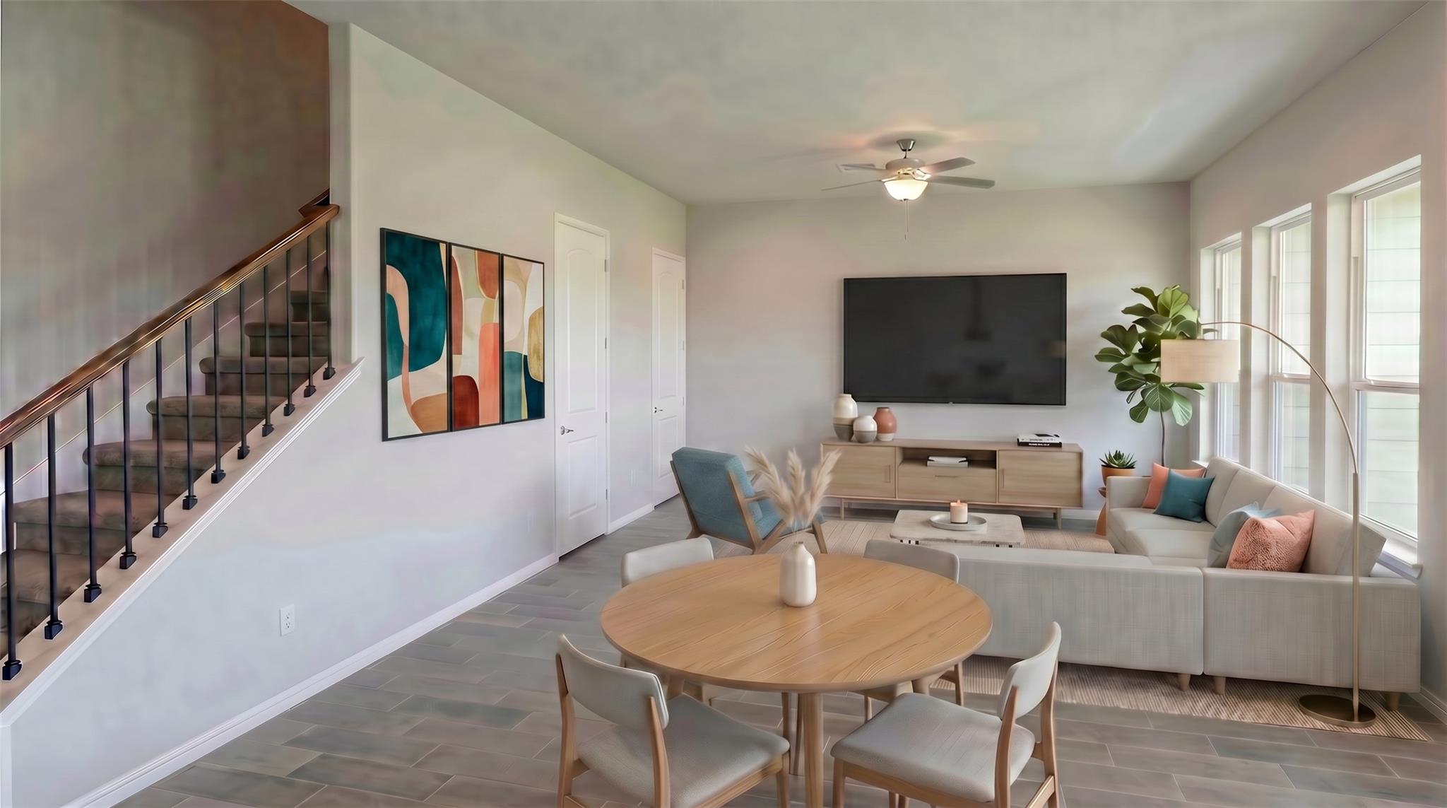 Natural light floods this inviting living area, f