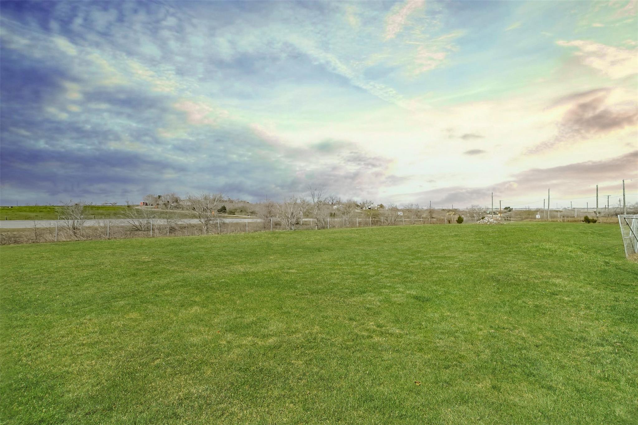 View of yard with a rural view