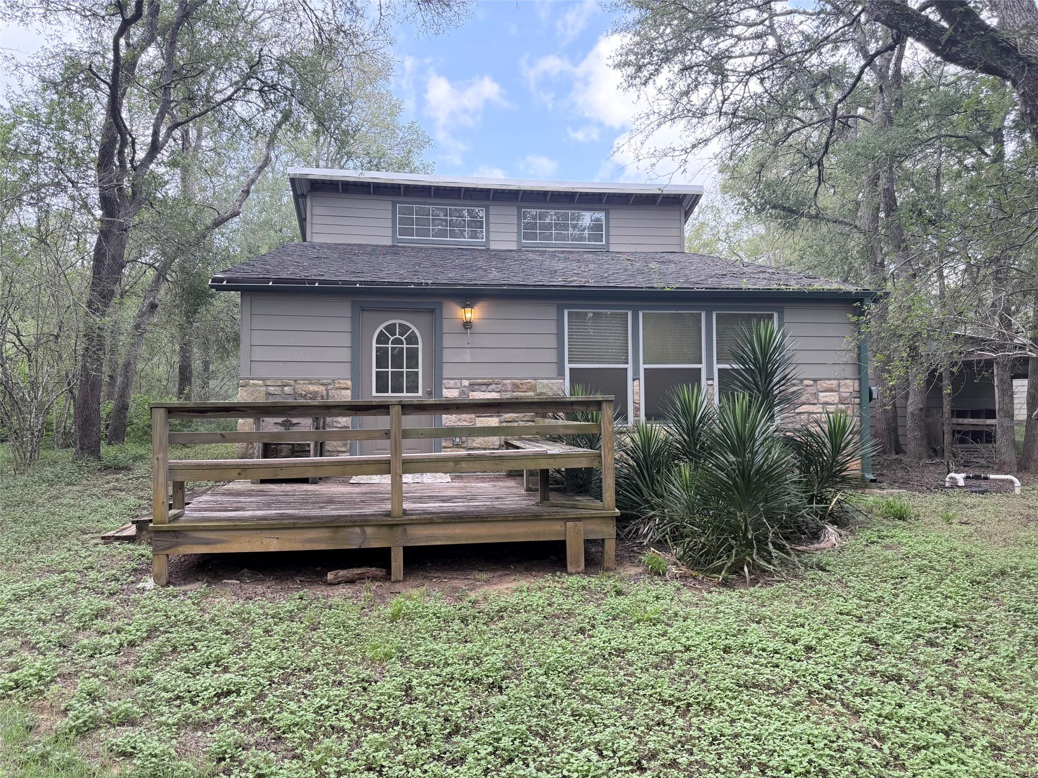 Rustic charm awaits with a private wooden deck, s