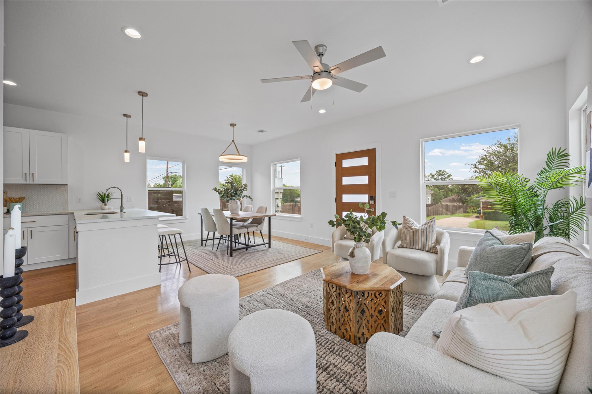 An open-concept layout unites the kitchen, dining