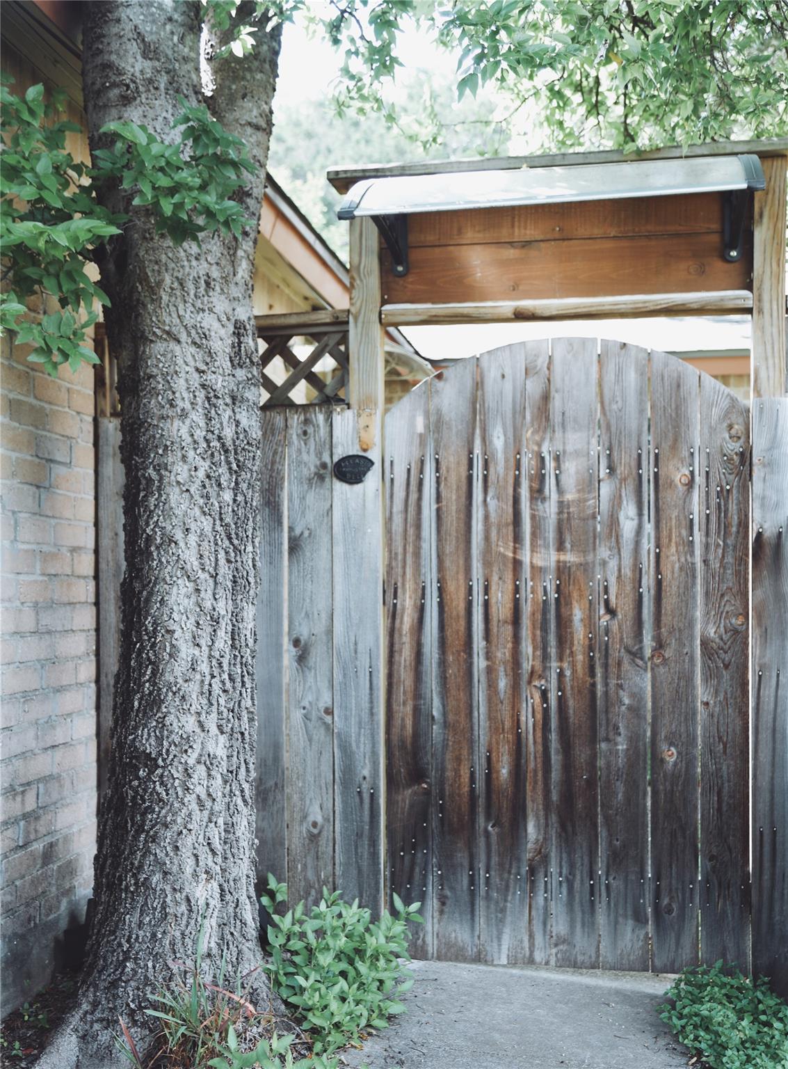 Secure, weathered wooden gate offering a private 
