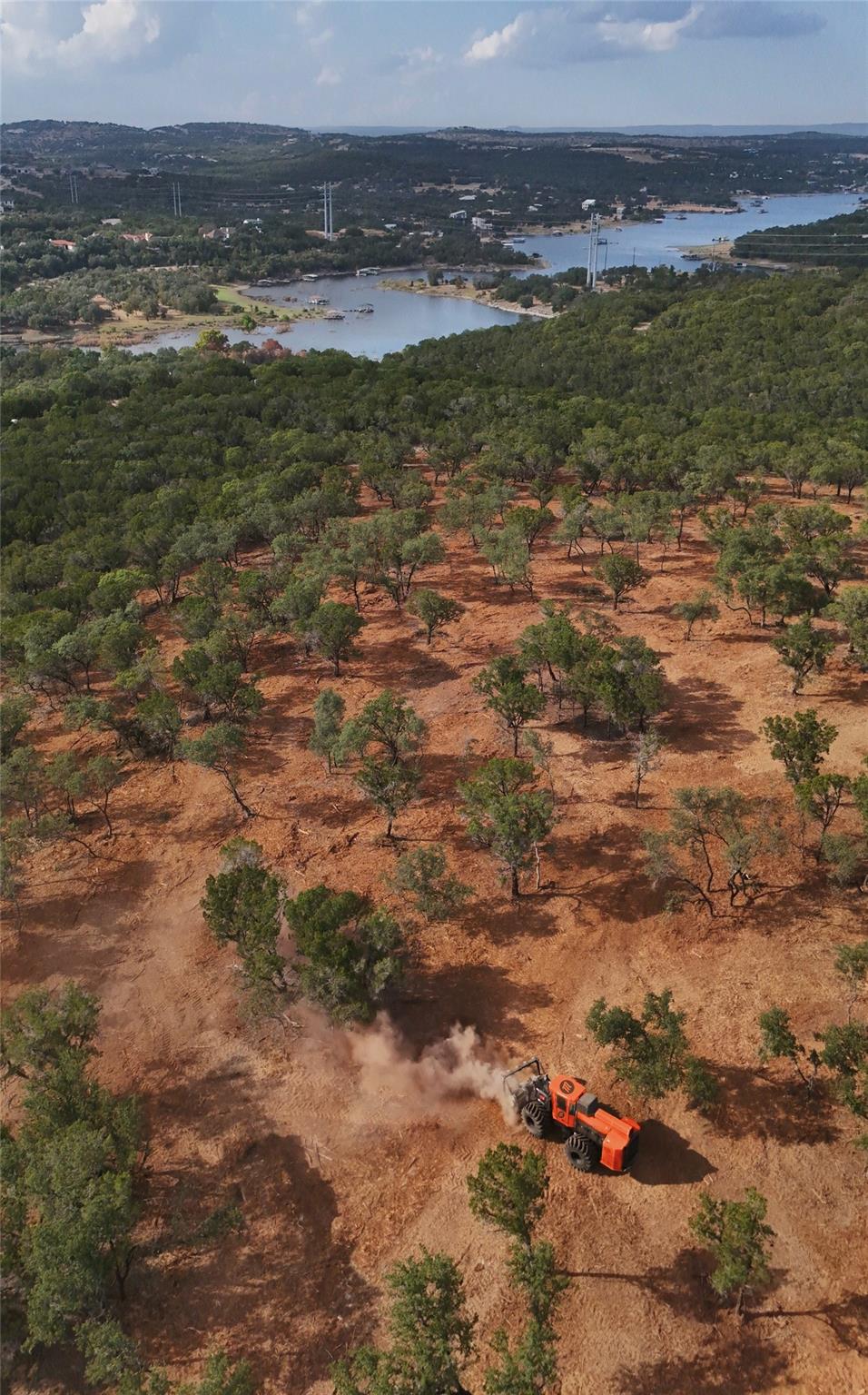 A sweeping aerial view showcases rolling hillside