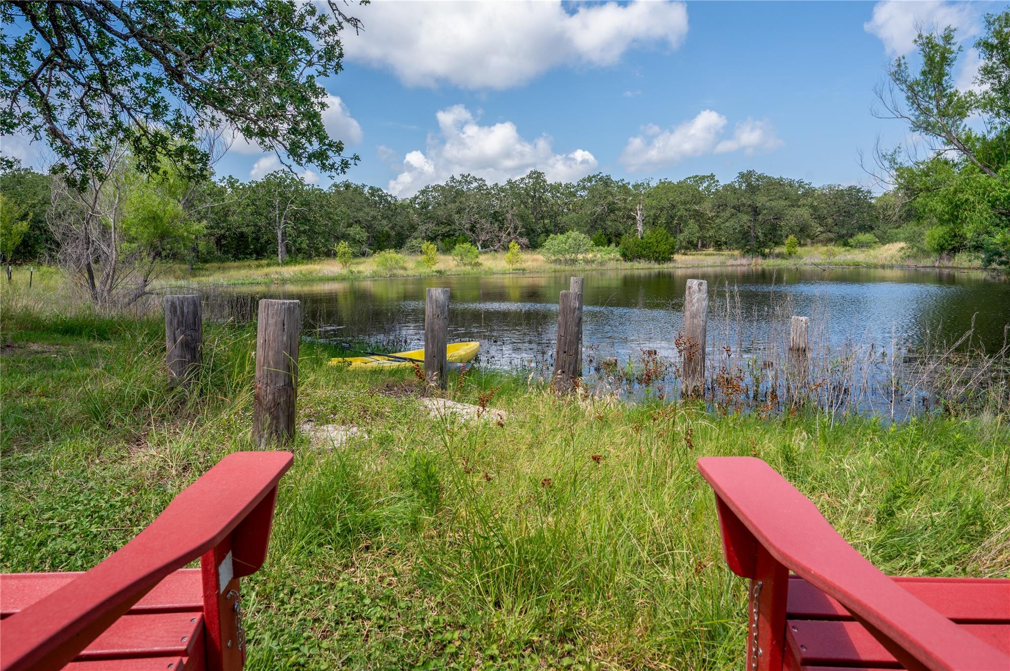 Relax in Adirondack chairs while enjoying tranqui
