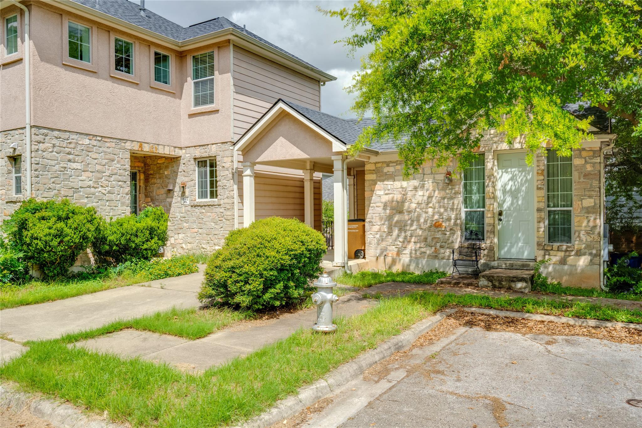 A welcoming stone and stucco facade offers charm 