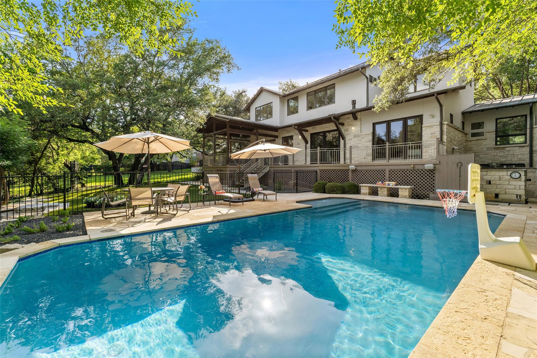 An inviting backyard oasis awaits with a sparklin