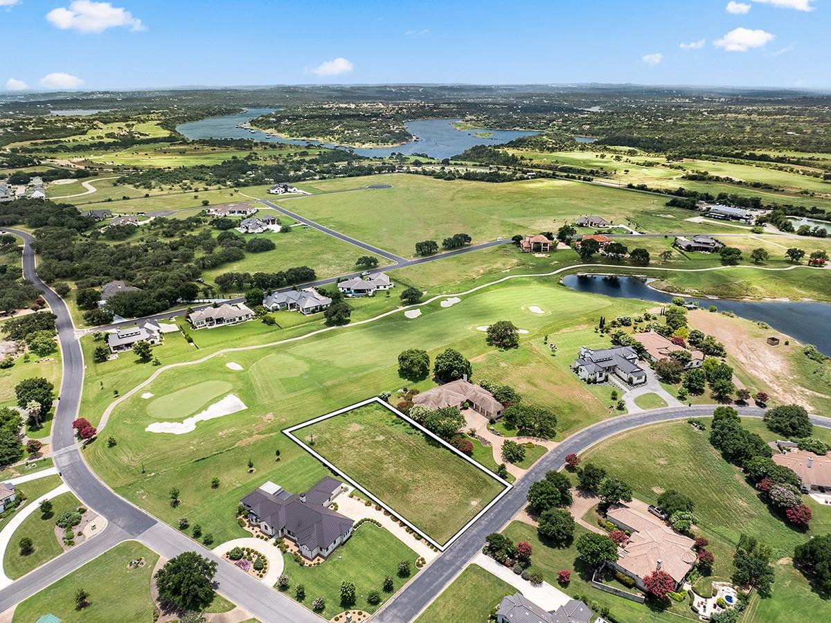 Golf course views meet lakefront serenity in this