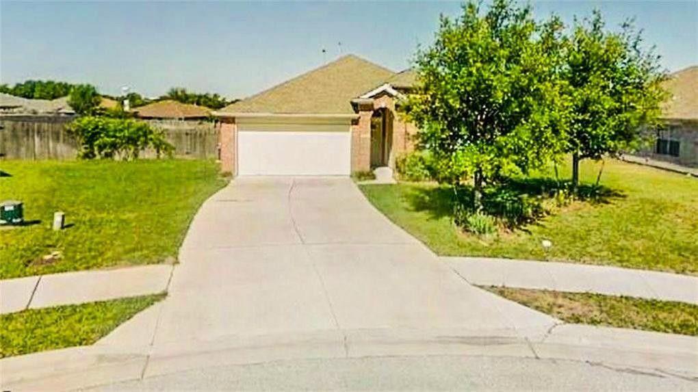 Well-maintained front lawn with mature trees and 