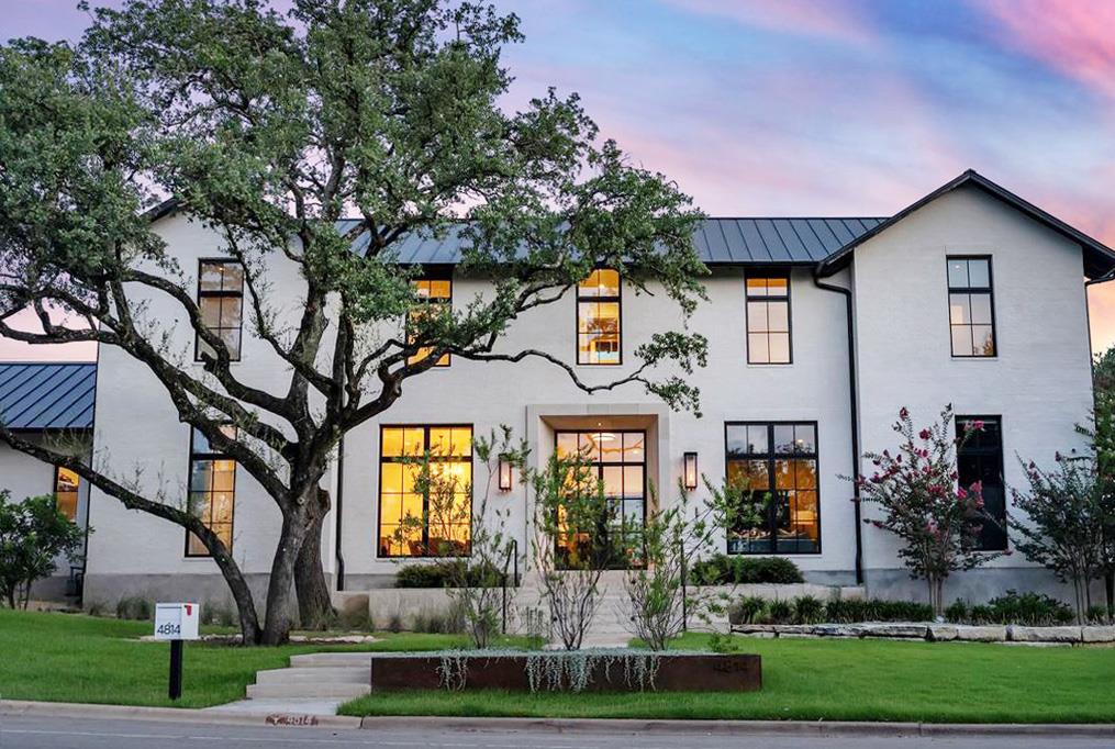 A graceful tree shades this striking modern farmh