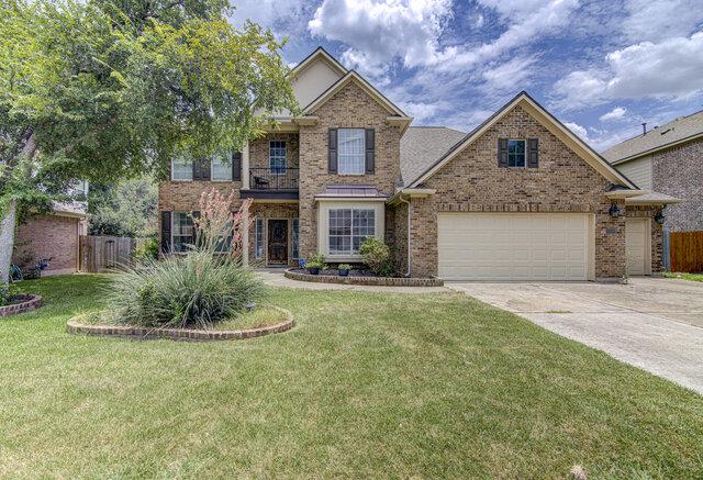 A classic brick facade welcomes you home, boastin