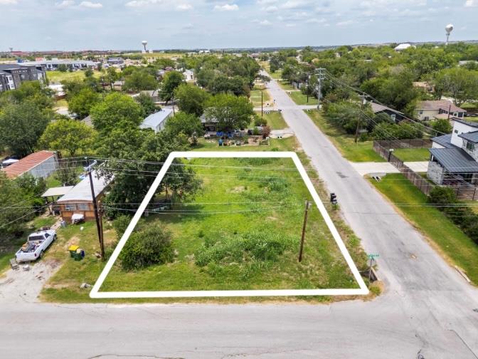 A generous corner lot offering ample space for a 