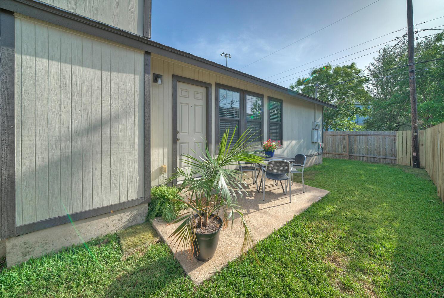 A private yard with a concrete patio offers a pea