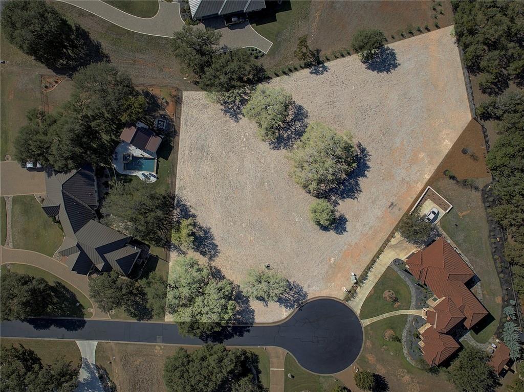 A spacious, tree-dotted lot awaits your custom ho