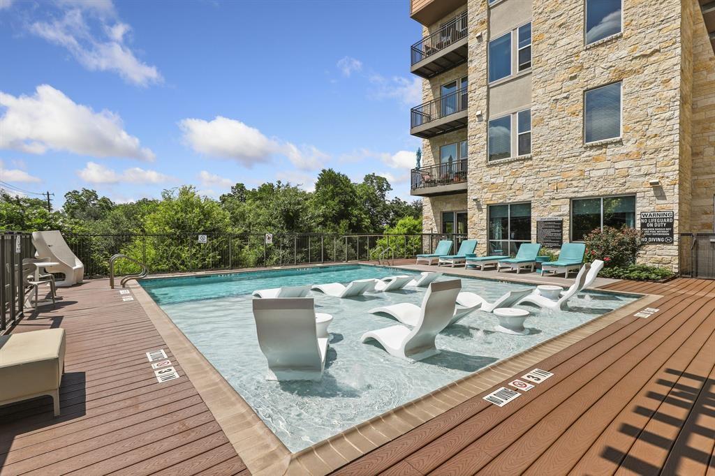 An inviting outdoor pool with integrated loungers
