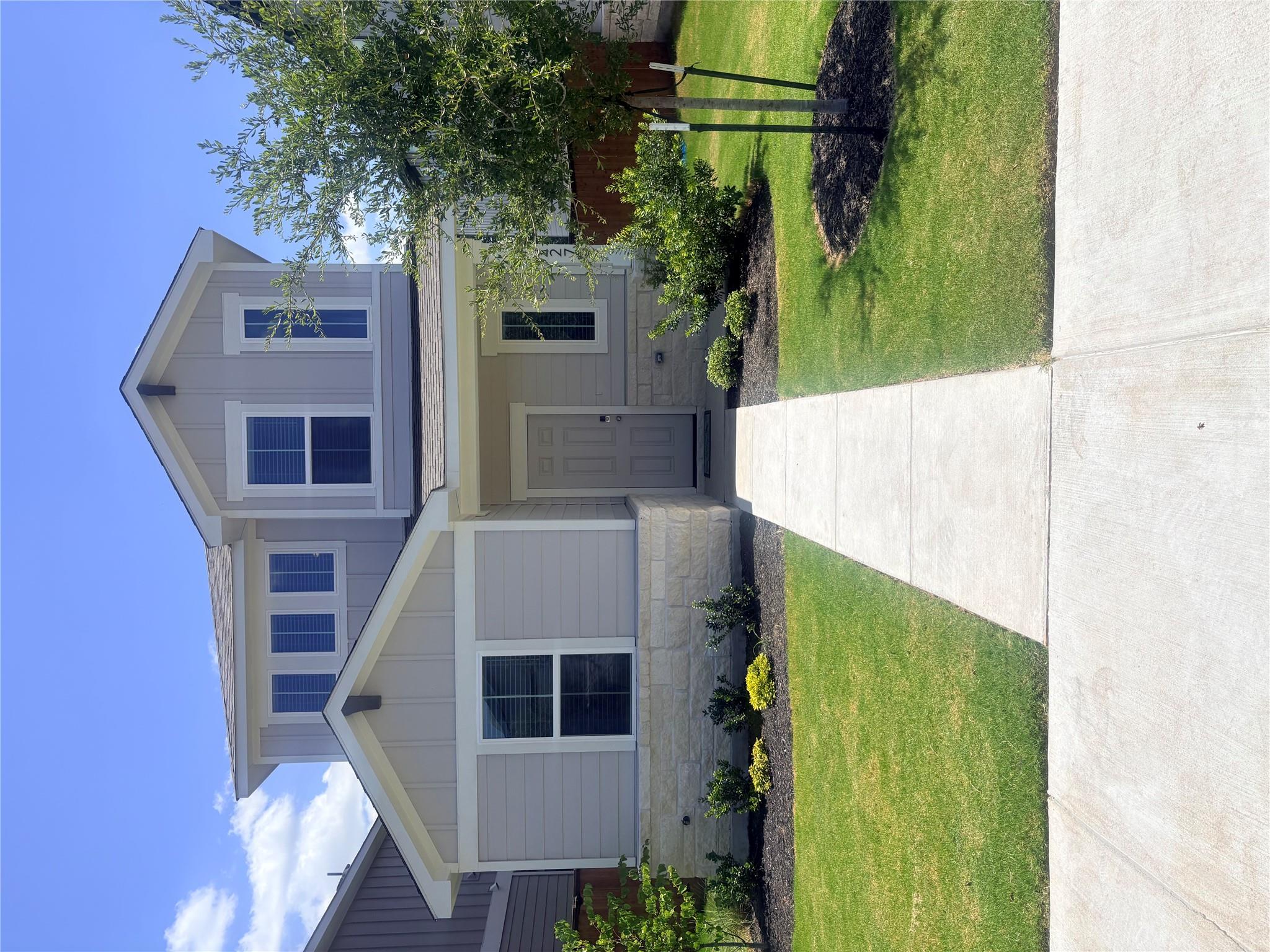 A well-maintained facade with neat landscaping an