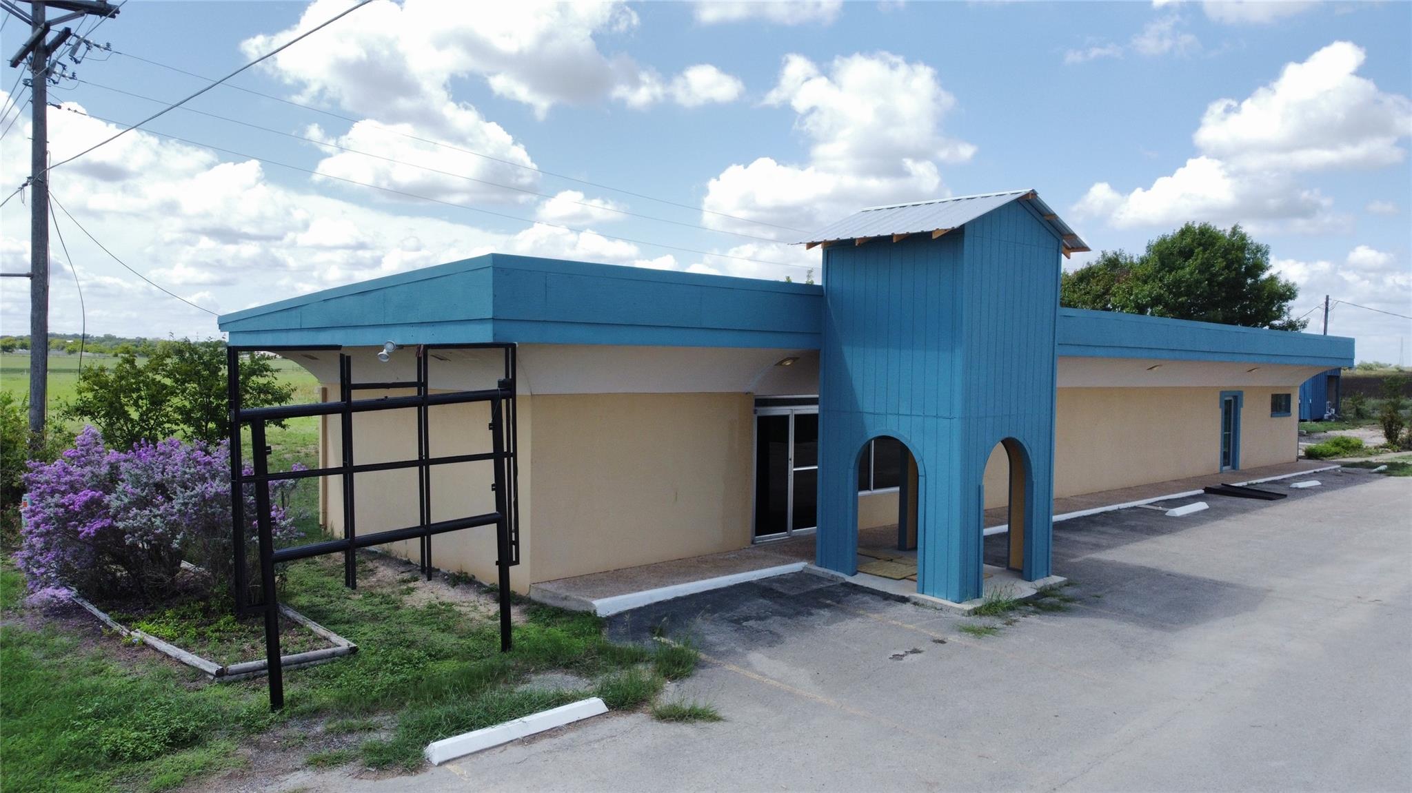 A commercial building with vibrant blue accents o