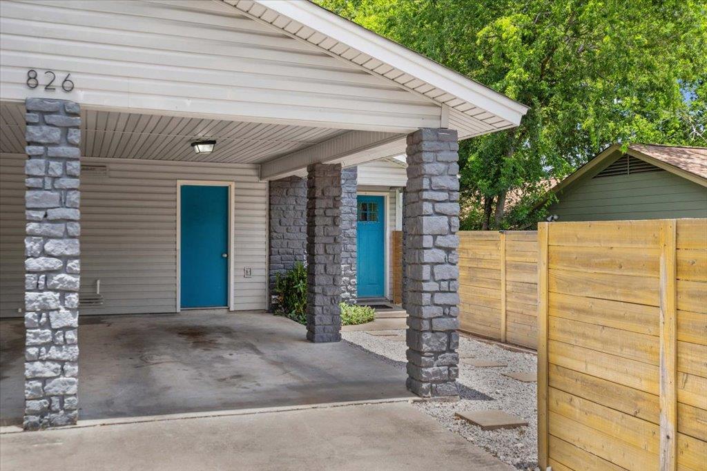 Bold blue doors and robust stone columns enhance 
