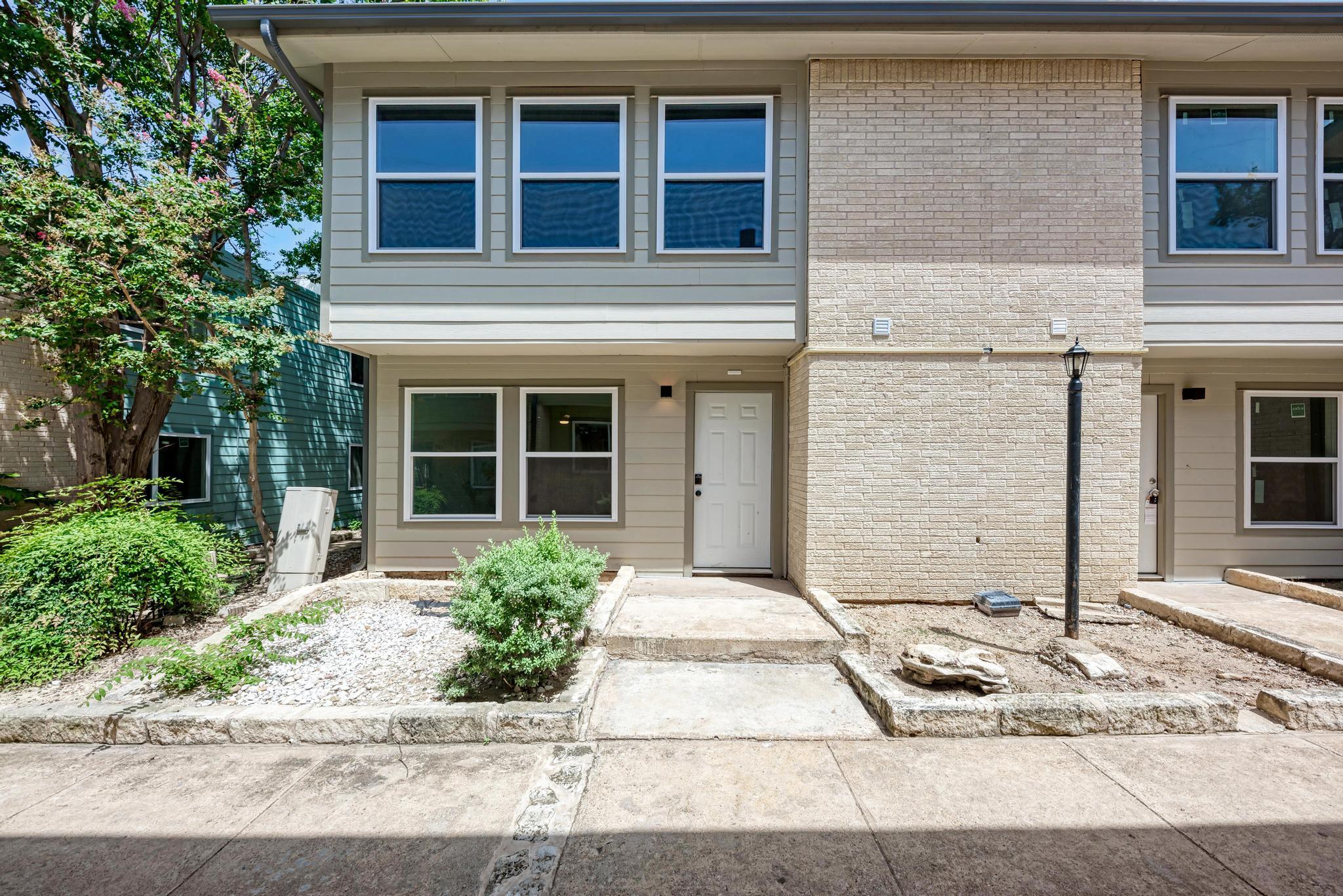 A welcoming entryway with low-maintenance landsca