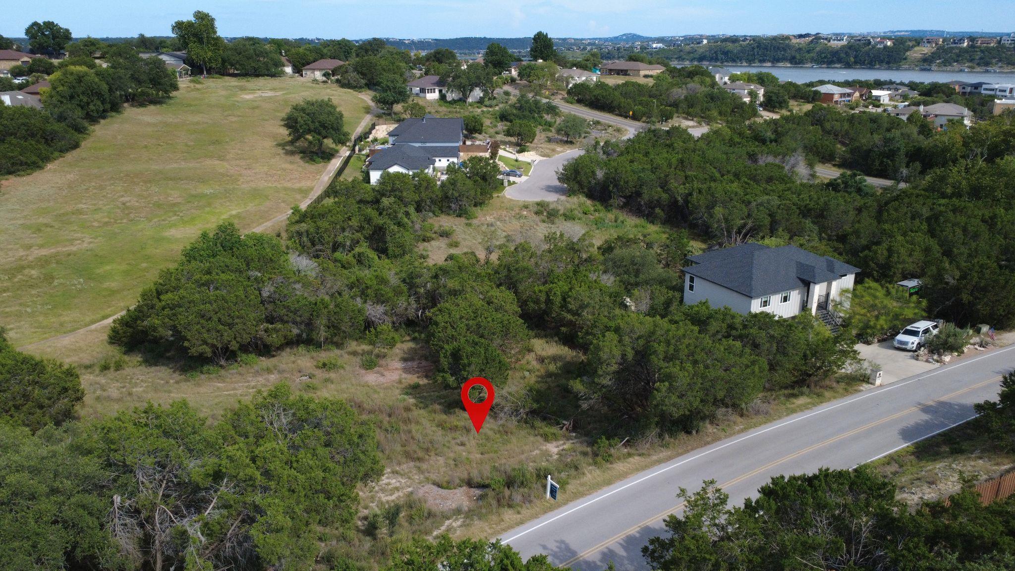 Vast, ready-to-build lot nestled among mature tre
