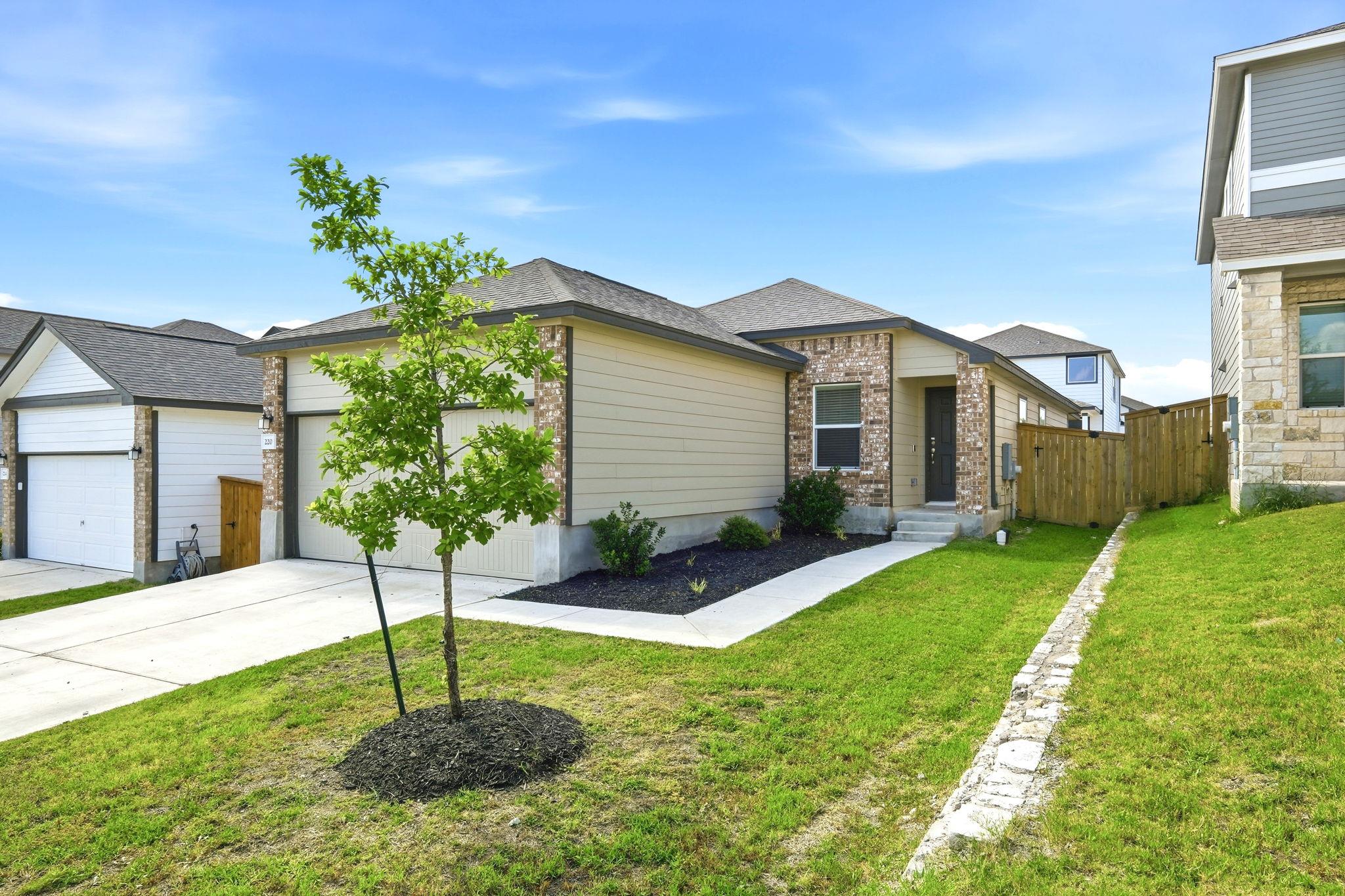 A newly constructed residence features a mix of b