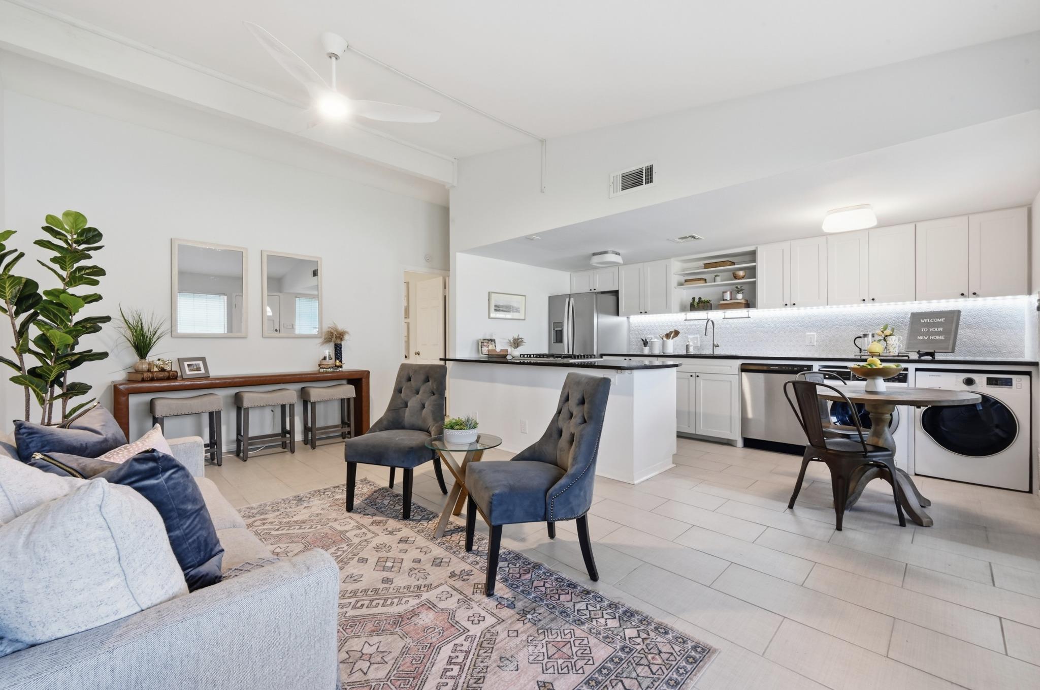 An open floor plan seamlessly connects the kitche
