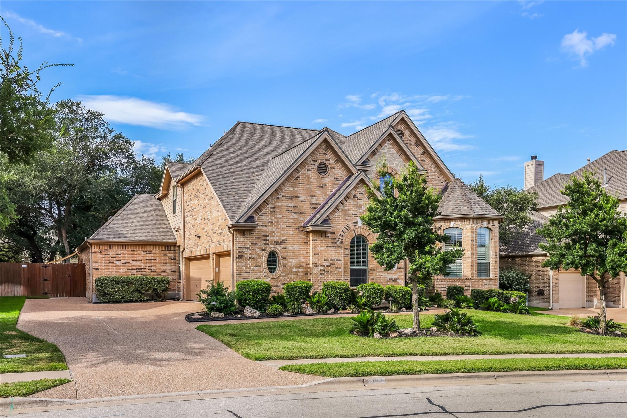 A well-manicured lawn complements this classic br