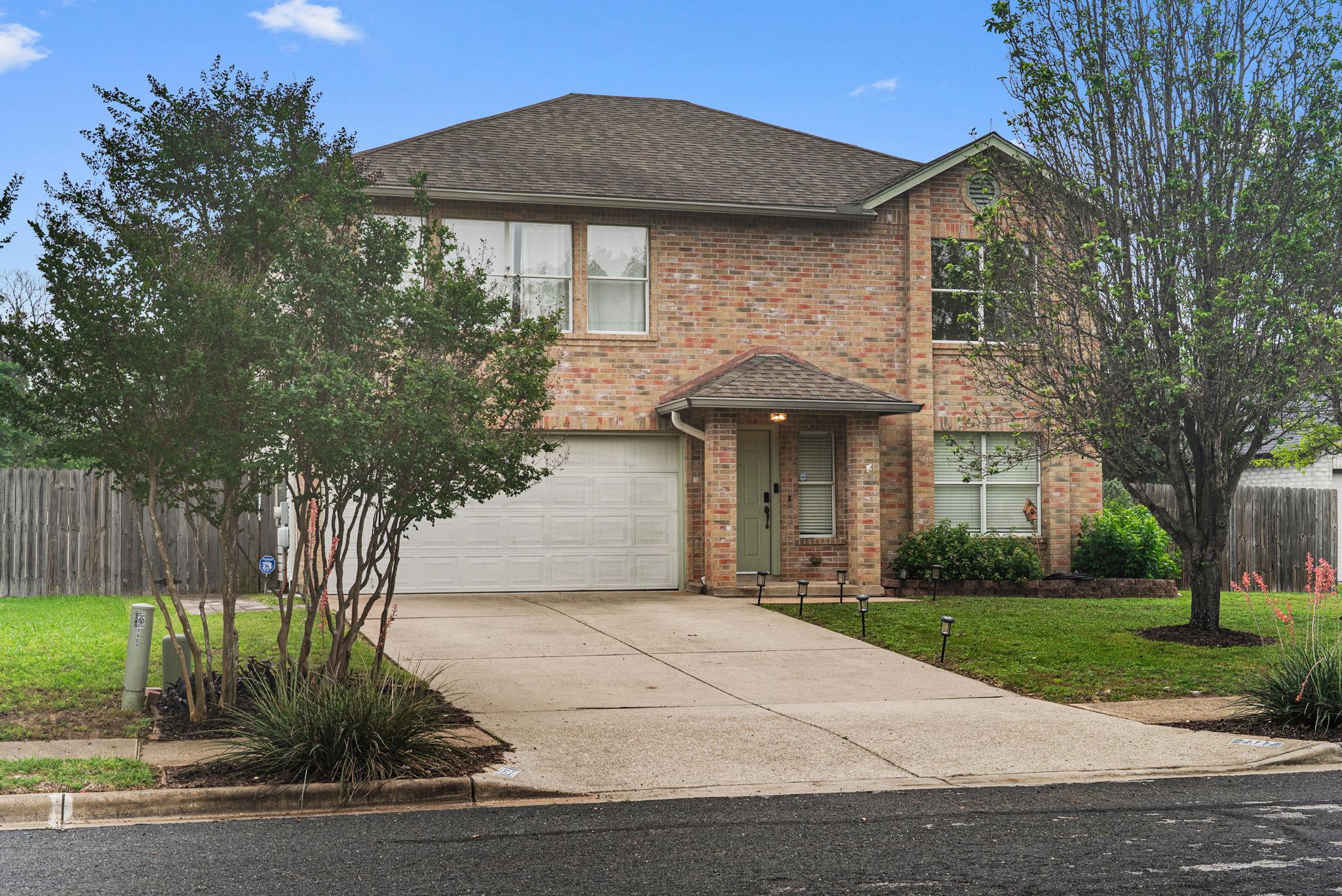 A well-maintained brick exterior with an attached