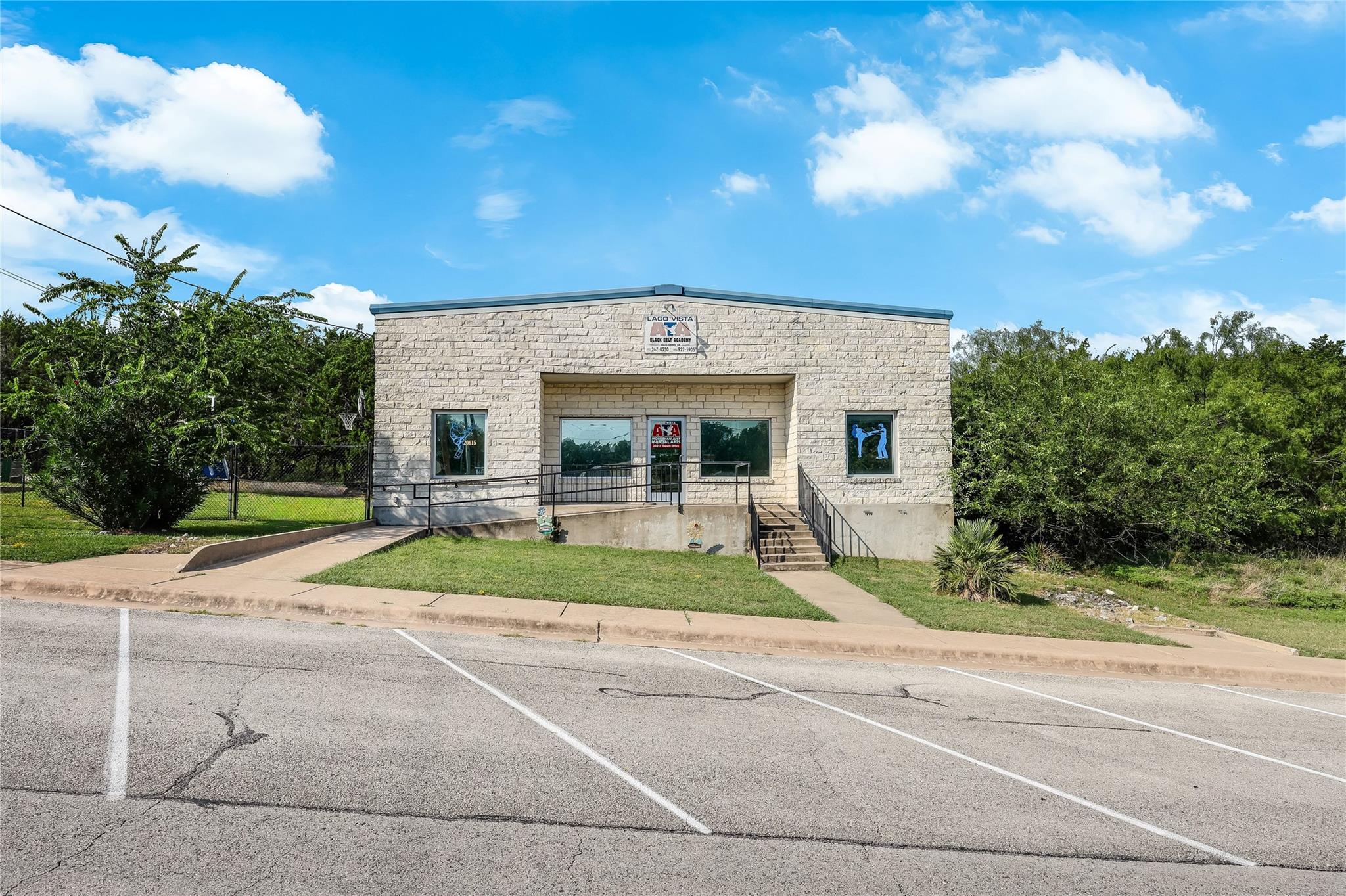 A commercial building with light-colored stone co
