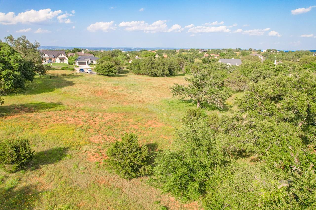 A sprawling lot offers abundant green space and m