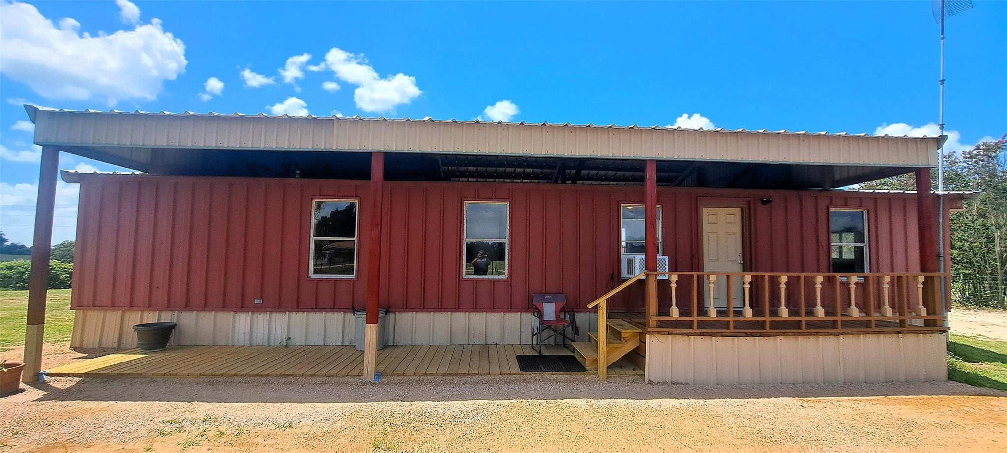 A rural retreat featuring a generous covered porc