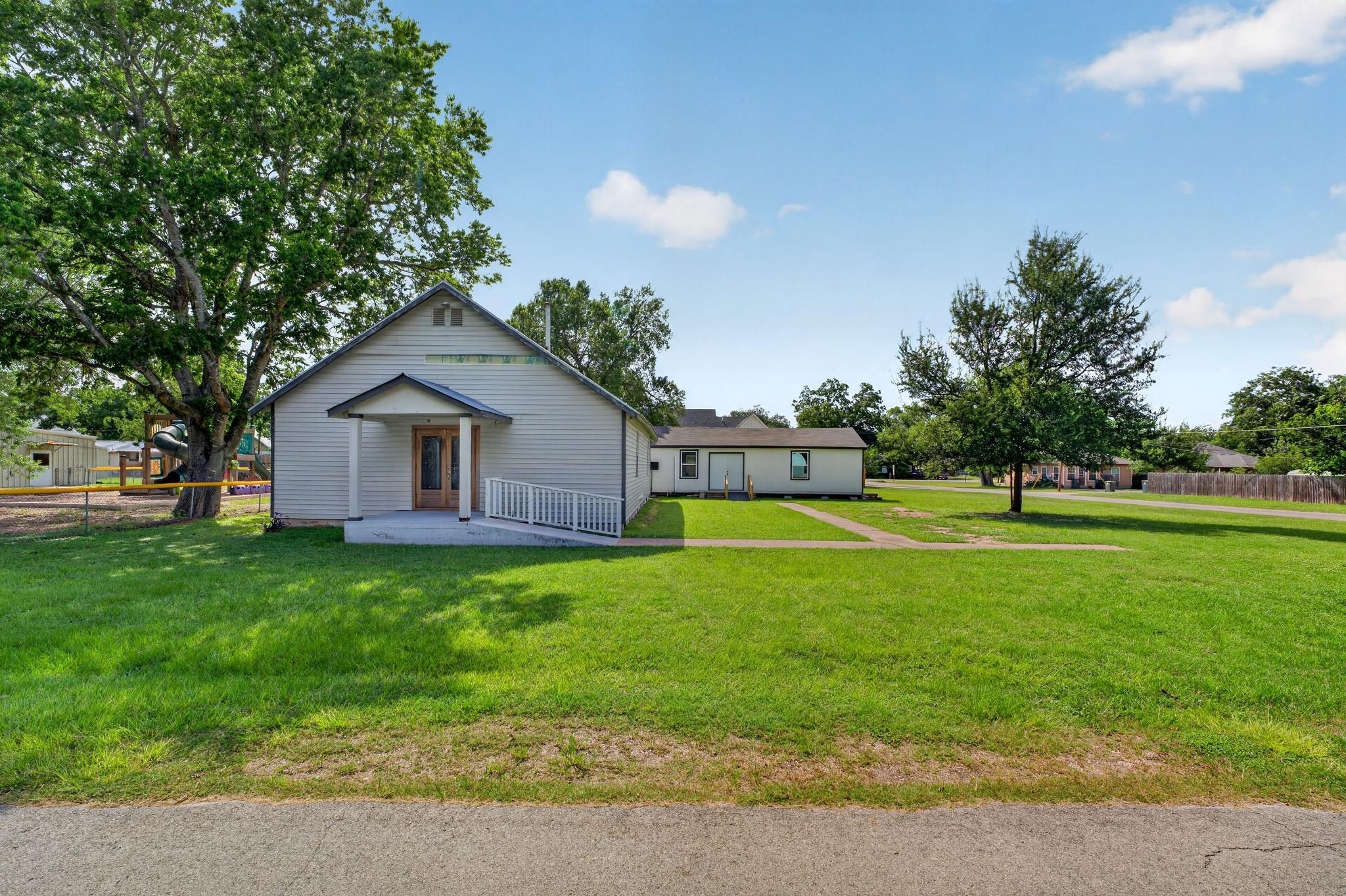 A welcoming facade with a convenient access ramp,
