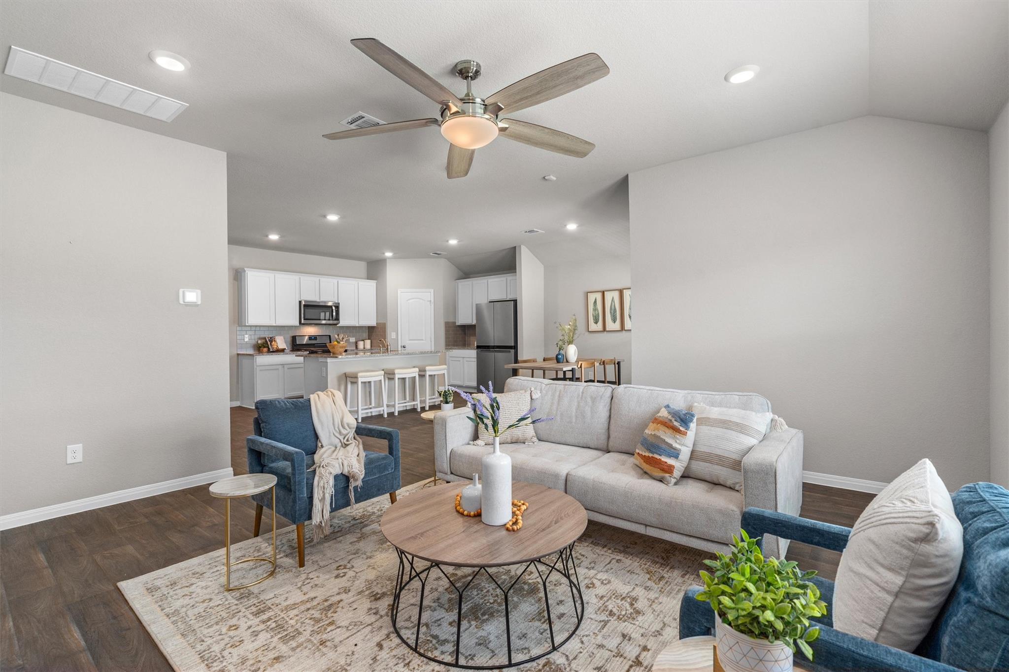 An inviting open-concept living area boasts reces