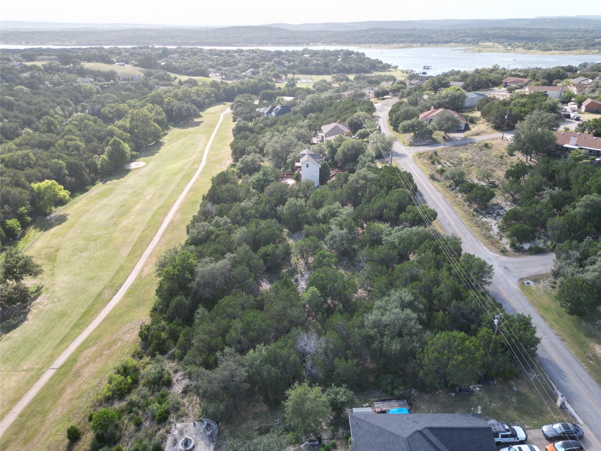 Overlooking a tranquil lake and a verdant golf co