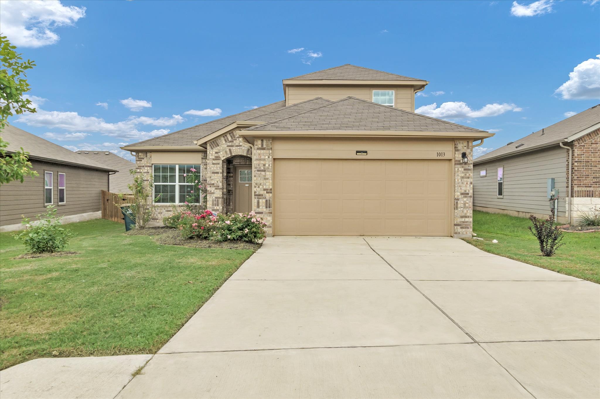 A welcoming front exterior featuring a combinatio