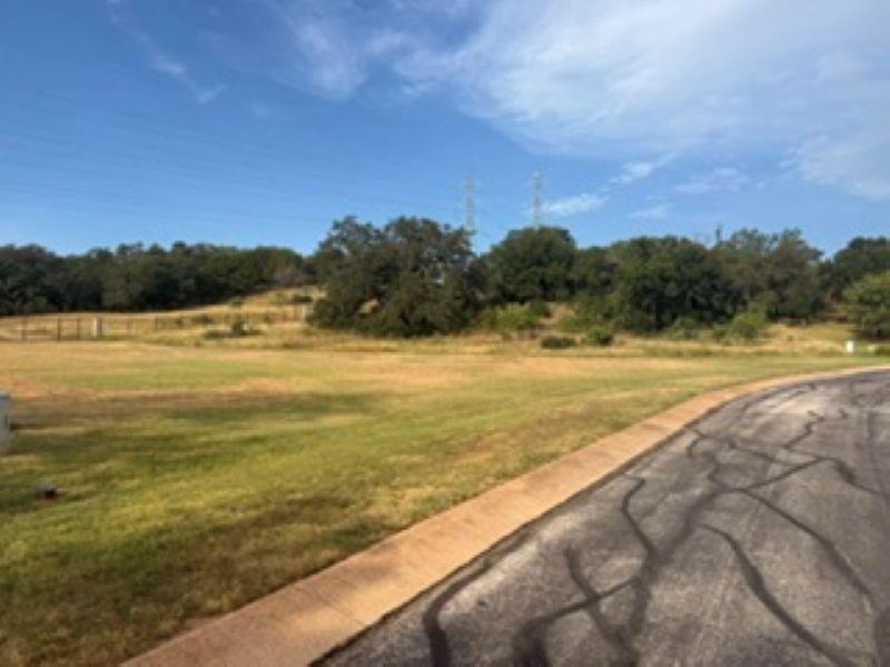 A spacious lot featuring a clear expanse of green