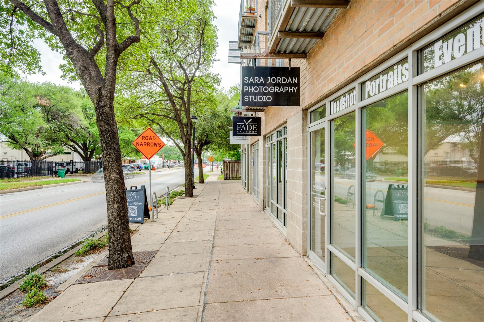 A vibrant commercial storefront with large glass 